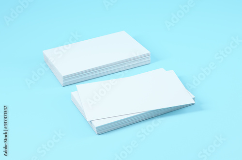 Two stacks of white business cards on blue background