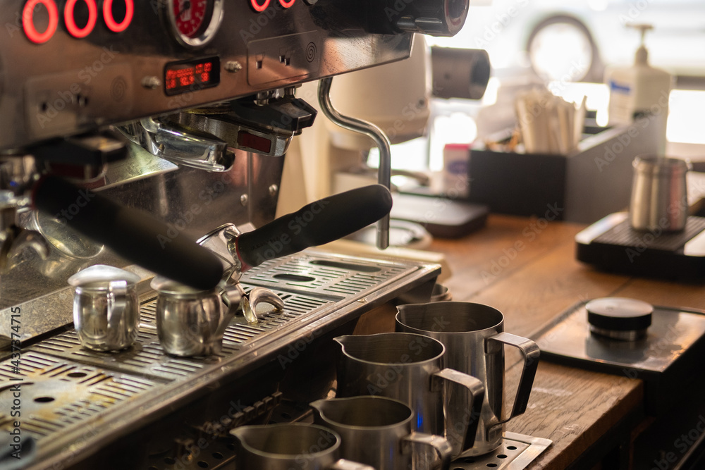 coffee machine in the cafe. The moment of preparation of the coffee drink. blur and selective focus coffee machine in the cafe. The moment of preparation of the coffee drink. blur and selective focus