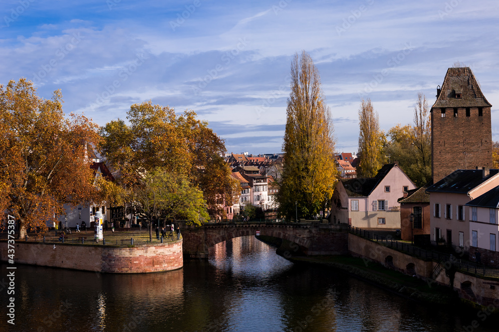 Strasbourg silhouette with panorama view of river bridges and brick towers of the island and the church La Petite France, Strasbourg, Alsace, France