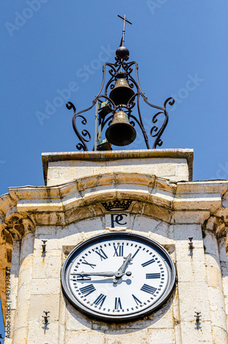 Pescocostanzo, Italy. August 24th, 2012. Detail of the clock and bell tower of the Palazzo del Governatore at Piazza Municipio in the historic centre of the town. photo