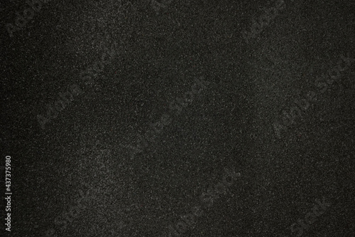 Black shiny glitter background. Blur