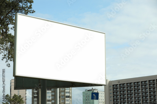 Blank advertising board in city. Mockup for design