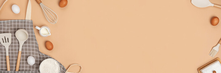 Banner made with baking ingredients and cooking utensil with copy space on light brown background. Template for your cooking design. Top view Flat lay Copy space