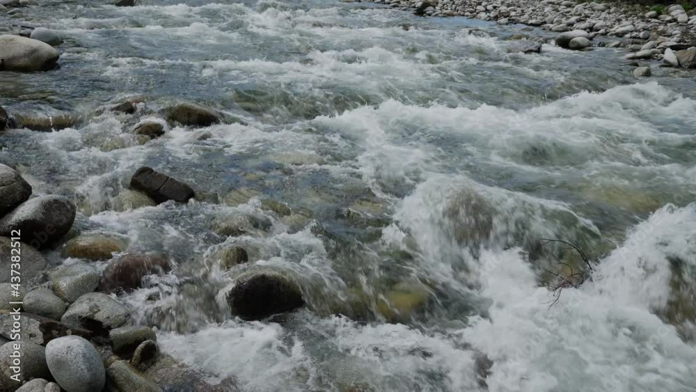The stream of the mountain stream. Close-up on the water. Slow motion. The stream of the mountain stream. Close-up on the water. Slow motion.