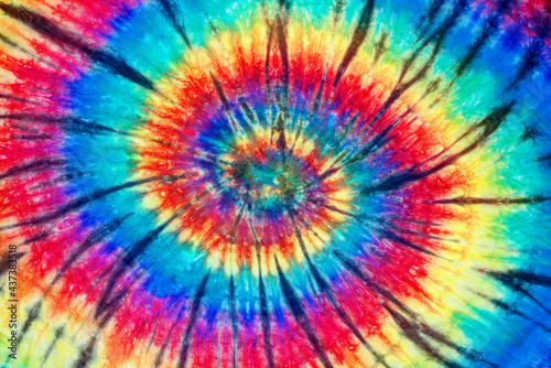 spiral tie dye pattern hand dyed on cotton fabric abstract texture background. © p-fotography