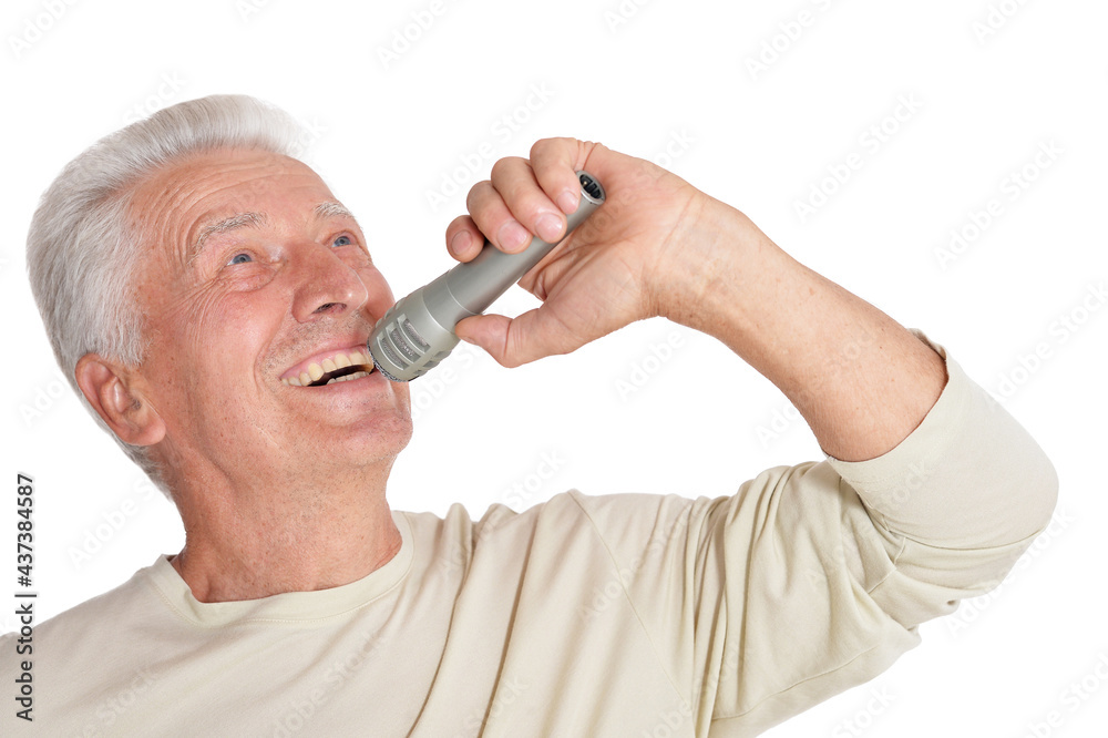 Senior man singing into microphone Senior man singing into microphone