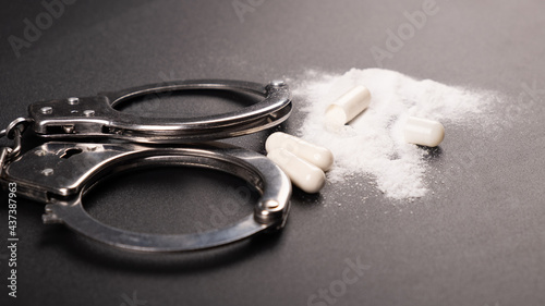 Принти на полотні arrest of a drug dealer, handcuffs and cocaine white powder.