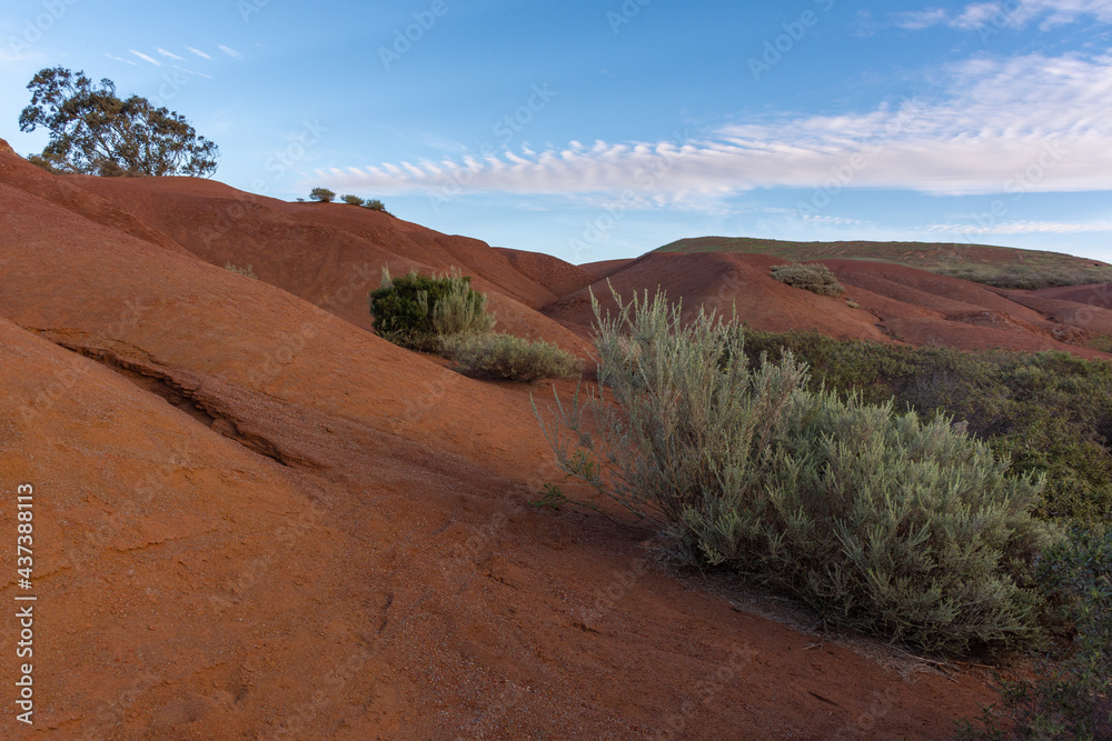 red desert landscape with beautiful sky