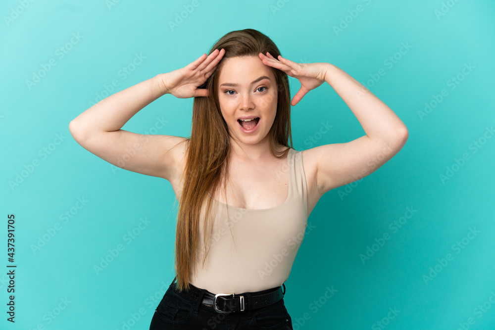 Teenager girl over isolated blue background with surprise expression
