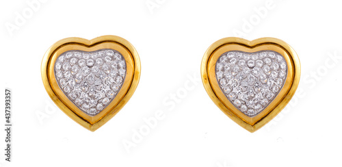 Pair of gold earrings with a heart shape isolated on a white background photo