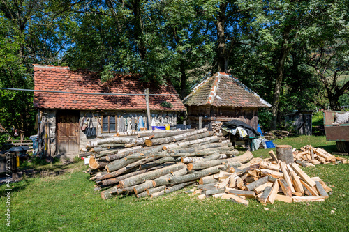 Huge pile of wood, preparations for the coming winter. Back yard of country house in Western Serbia