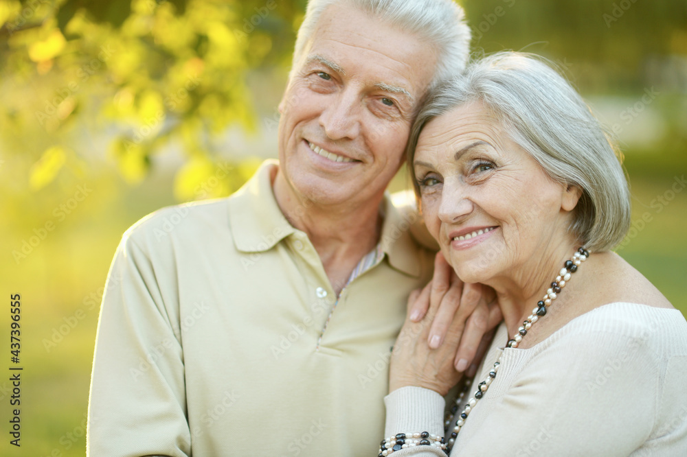 smiling senior couple in autumn park smiling senior couple in autumn park