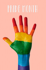 hand painted as rainbow flag and text pride month