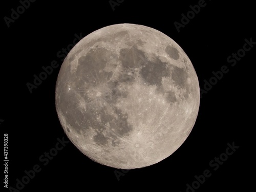 Full moon in the black sky. Detailed view.