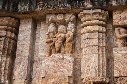 Close up of Kamasutra scenes on the wall of Konark sun temple, Odisha  photo