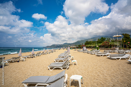 Fototapeta Naklejka Na Ścianę i Meble -  Cleopatra beach on sea coast with green rocks in Alanya 