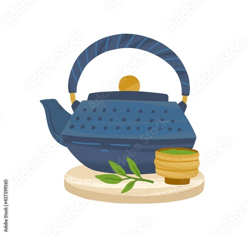 Japanese cast-iron teapot, matcha powder in wooden bowl and green tea leaf se...