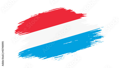 Foto Patriotic of Luxembourg flag in brush stroke effect on white background