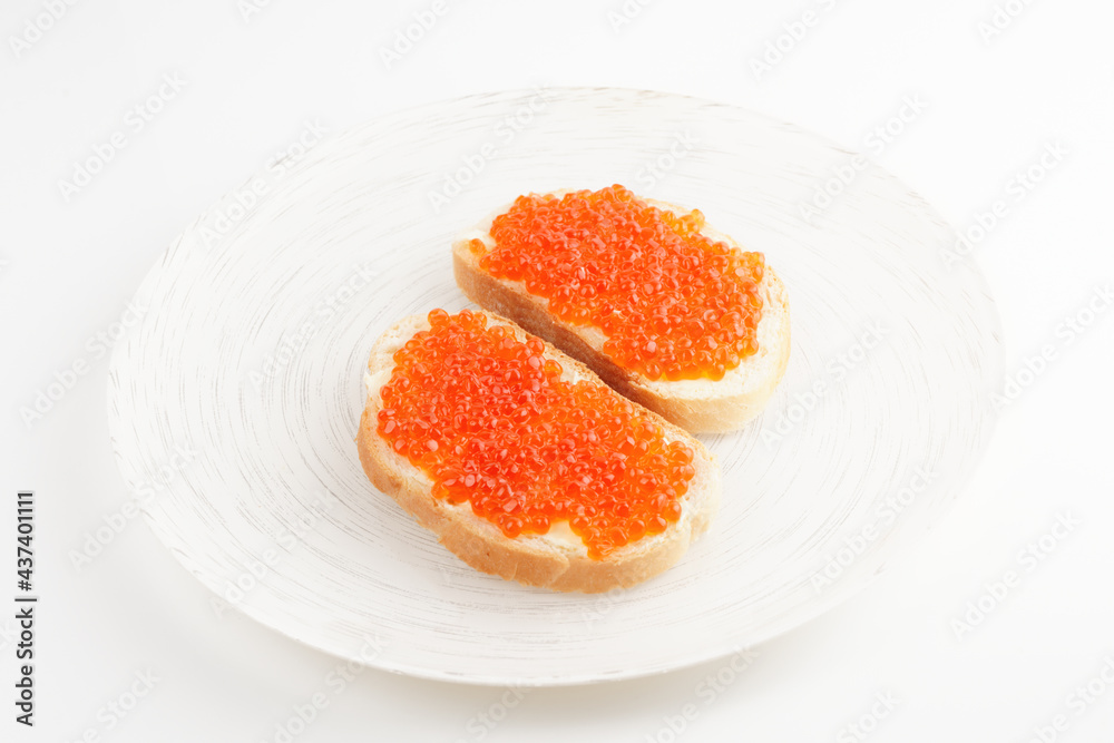 Two loaves of bread with red salmon roe Two loaves of bread with red salmon roe
