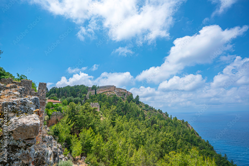 Naklejka premium One of the symbols of Alanya – the Alanya castle over the rocky peninsula in the middle of the city.
