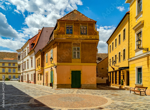 Fotografie Cobblestone street and square with old houses in downtown of Gyor, Hungary