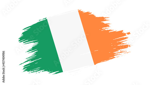 Patriotic of Ireland flag in brush stroke effect on white background photo