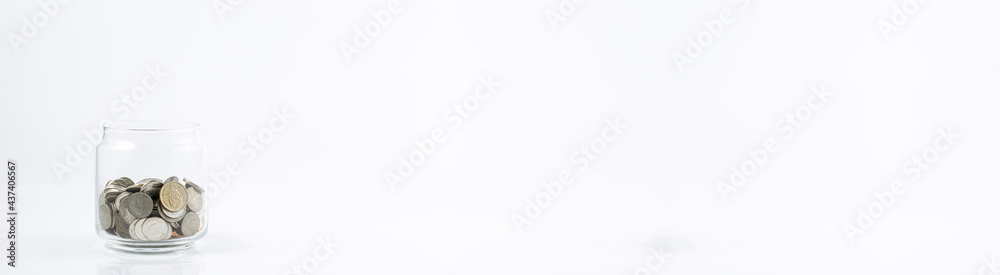 coin in glass bottle on white background,Coin in glass jar, Saving money concept on white background. coin in glass bottle on white background,Coin in glass jar, Saving money concept on white background.