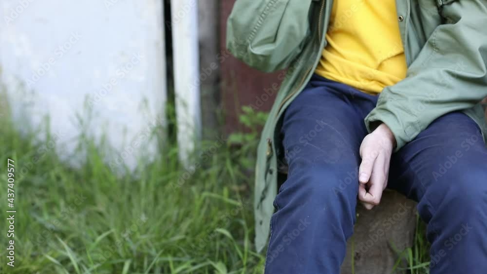 Guy holds cigarette in his hand. Guy smokes in nature. Details of smoke break in fresh air. Smoking is harmful to health. Guy holds cigarette in his hand. Guy smokes in nature. Details of smoke break in fresh air. Smoking is harmful to health.