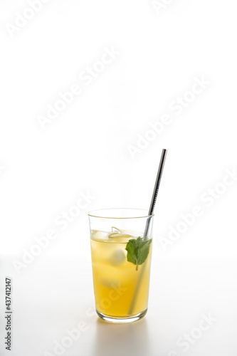 glass of citrus lemonade with ice and mint