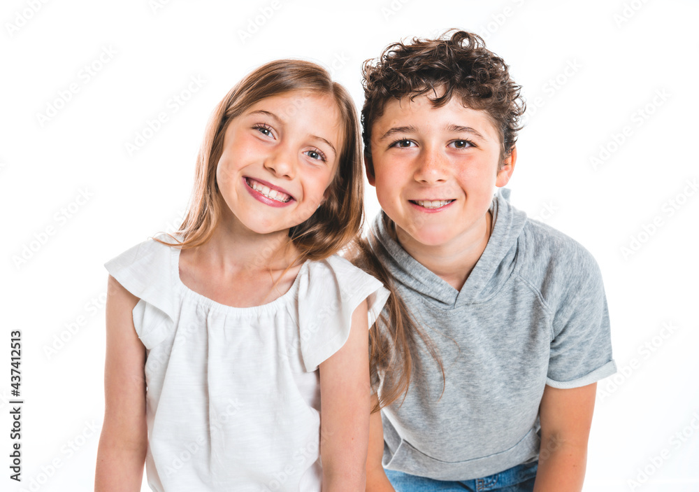 Portrait of cute girl and boy on studio white background Portrait of cute girl and boy on studio white background