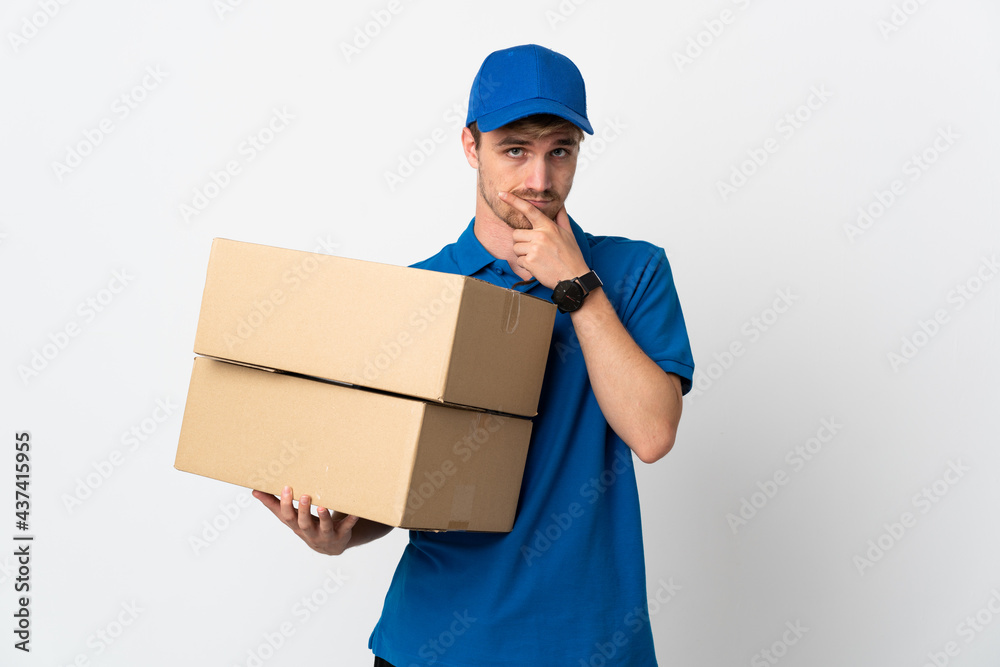 Young delivery blonde man isolated on white background thinking Young delivery blonde man isolated on white background thinking