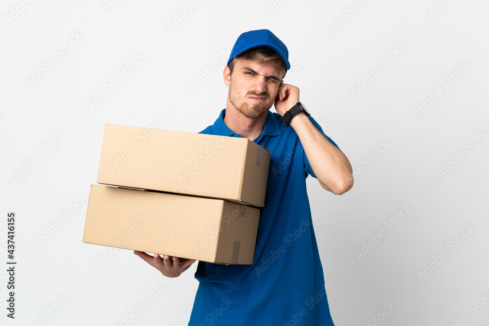 Young delivery blonde man isolated on white background frustrated and covering ears Young delivery blonde man isolated on white background frustrated and covering ears