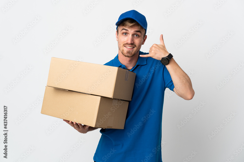 Young delivery blonde man isolated on white background making phone gesture. Call me back sign Young delivery blonde man isolated on white background making phone gesture. Call me back sign
