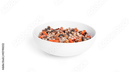 Buckwheat with vegetables in white bowl. Buckwheat porridge with mushrooms and carrots isolated on a white background.