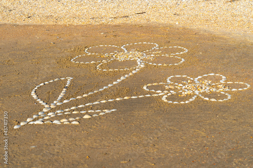 Drawing on a sandy beach.