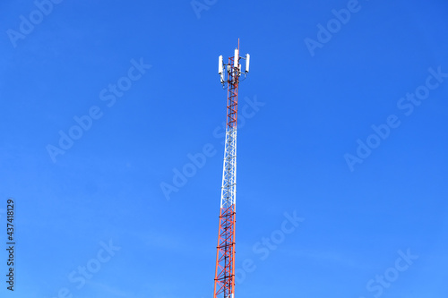 Telephone pole on the background of the blue sky