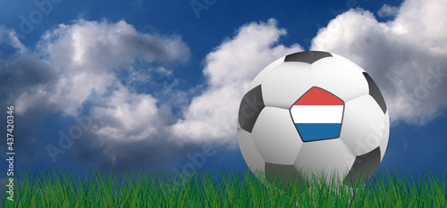 Football with flag of the Netherlands. Soccer on green football grass field. Blue sky background banner. wk  ek play model. Sport finale or school  sports game cup. Street ball games. 2021