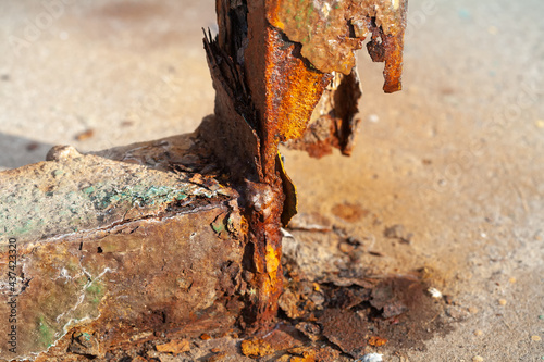 Metal delamination and very severe corrosion of the steel beam. Soft focus. photo