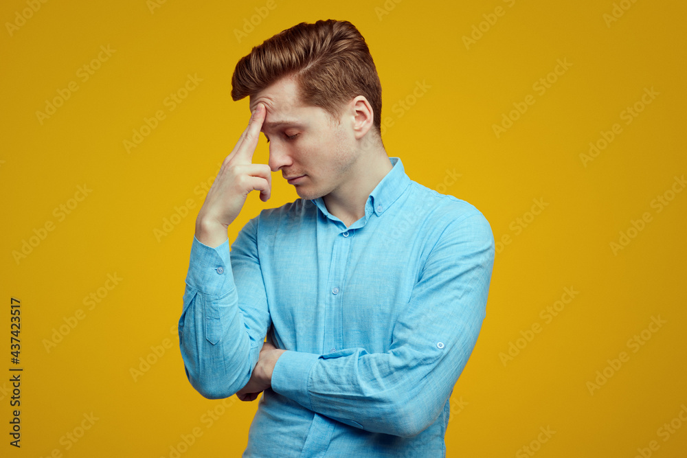 Overworked student closes eyes, tries to concentrate and continue to work Overworked student closes eyes, tries to concentrate and continue to work