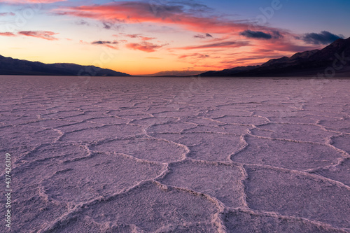 Salt Pan at the Badwater Basin, Death Valley National Park, California, United States. Dramatic Colorful Sunset Sky Art Render.