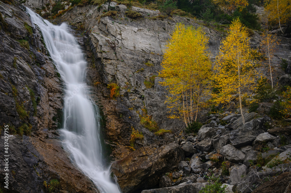 Cascade in the Bujaruelo valley in autumn (Ordesa and Monte Perdido National Park, Pyrenees, Spain)