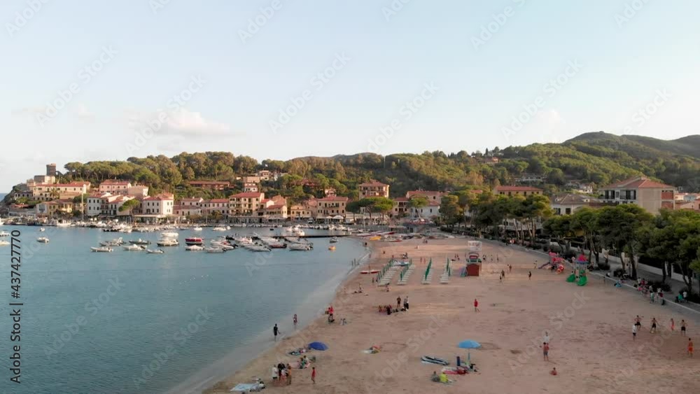 Aerial view of Marina di Campo coastline at sunset, Elba Island - Italy Aerial view of Marina di Campo coastline at sunset, Elba Island - Italy