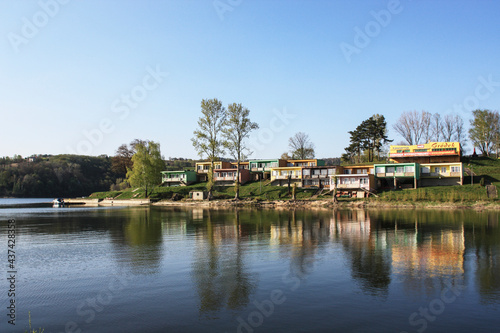 GRODEK NAD DUNAJCEM, POLAND - MAY 28, 2021: Cottages for tourists right on the lake Roznowskie