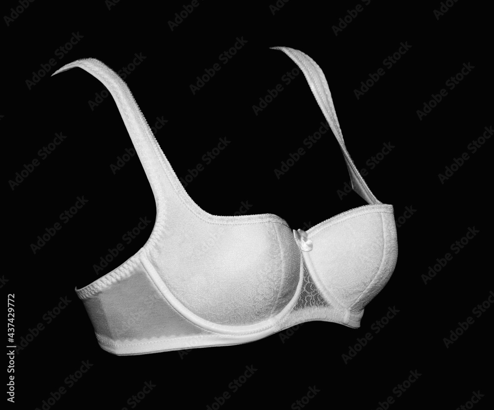 White lace fashion bra push up balconette on a black background. White lace fashion bra push up balconette on a black background.