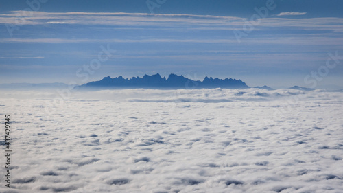Montserrat mountain above a sea of clouds seen from Rasos de Peguera range, in the Pre-Pyrenees (Berguedà, Catalonia, Spain) © Sergi_Boixader