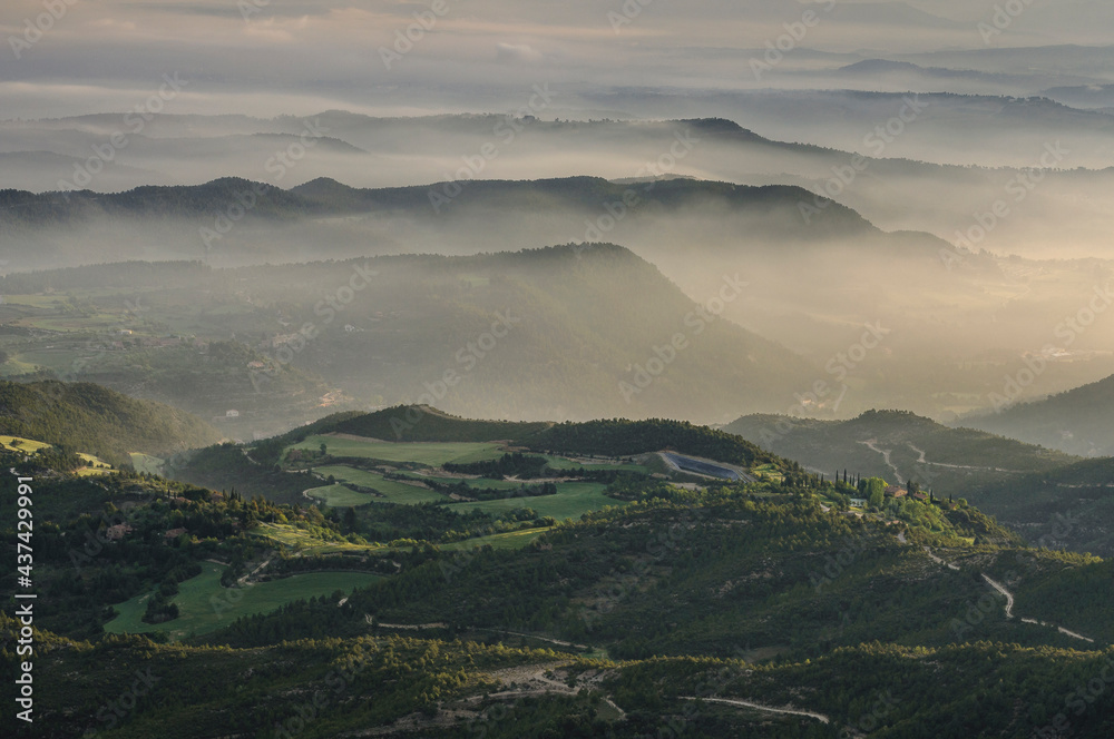 Morning mists over Pla de Bages at sunrise, seen from the Montserrat mountain (Barcelona province, Catalonia, Spain)