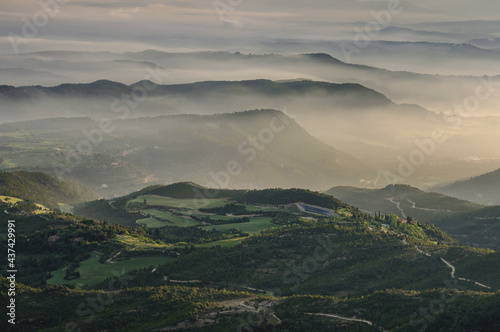 Morning mists over Pla de Bages at sunrise, seen from the Montserrat mountain (Barcelona province, Catalonia, Spain)