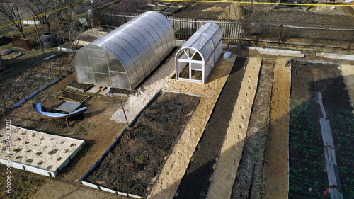 Garden beds. Vegetable garden top view. Garden design and greenhouse layout.