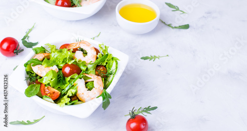 Delicious and healthy shrimp salad with herbs and tomatoes. Dietary nutrition for weight loss. Recipe for cooking fresh seafood. Mediterranean cuisine.