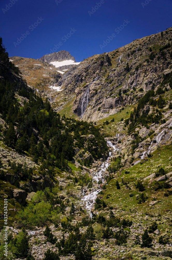 Ravines above the Cavallers reservoir, with the Besiberri Nord summit in the background (Boí Valley, PN AIgüestortes and Sant Maurici, Catalonia, Spain, Pyrenees)